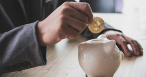 man holding a bitcoin