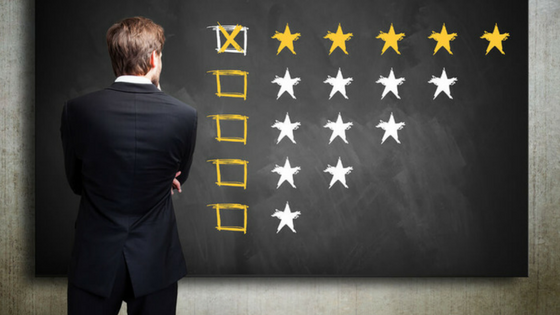 a man standing in front of a blackboard with stars drawn on it