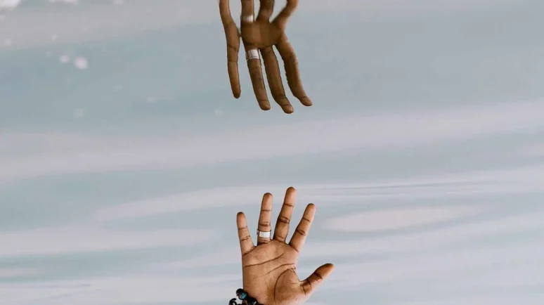 a hand and its reflection