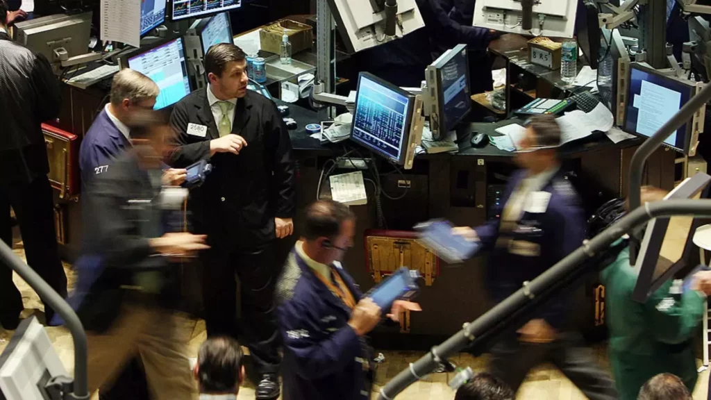 Traders work on the floor of the New York Stock Exchange